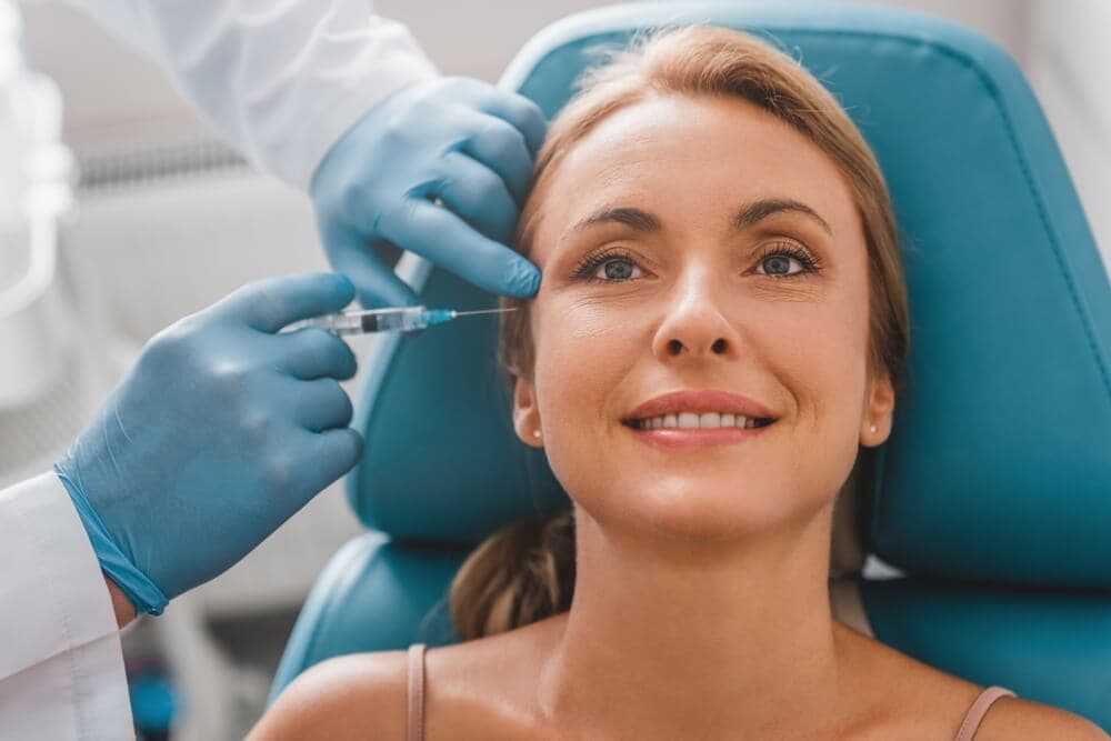 Attractive,Adult,Woman,Getting,Rejuvenating,Facial,Injections,In,Clinic.,Anti-age